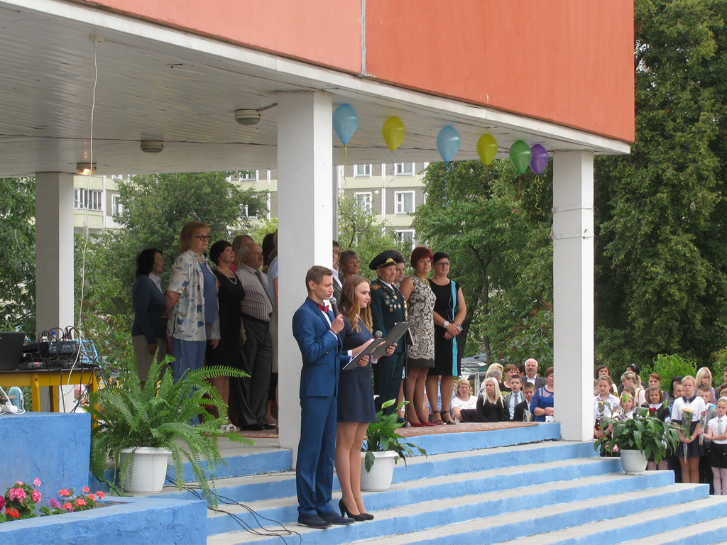 The opening of a celebratory assembly called Lineika. School children line up on the school quadrangle to listen to the welcome address by the headmaster and veterans.